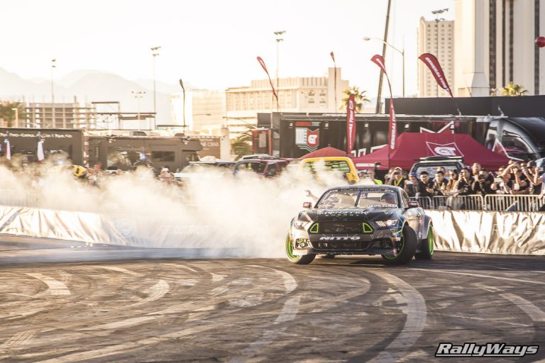 Mustangs drifting and leaving behind plenty of smoke.